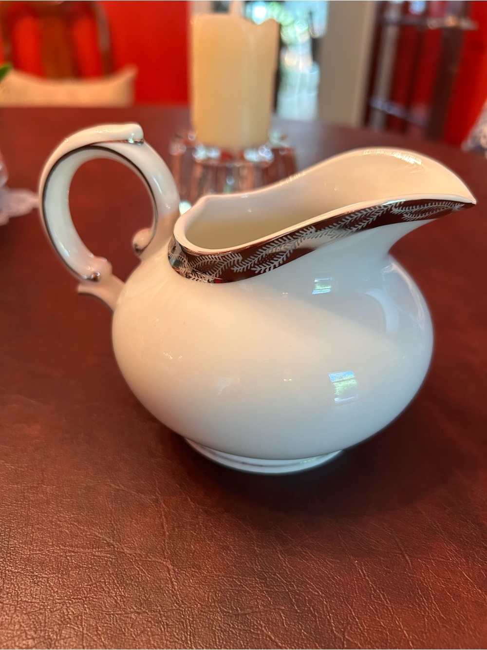 Fukagawa "Silver Lichen" porcelain creamer with a curved handle.
